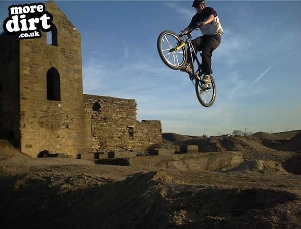 Me hitting a big jump at an old Lead Mines/quarry 