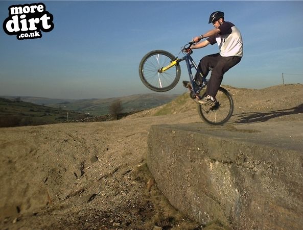 Me hitting a big jump at an old Lead Mines/quarry 
