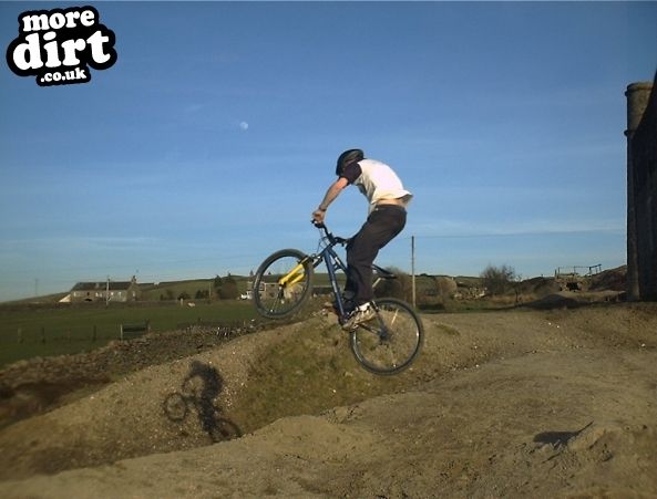 Me hitting a big jump at an old Lead Mines/quarry 