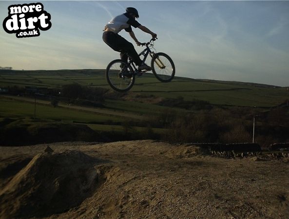 Me hitting a big jump at an old Lead Mines/quarry 