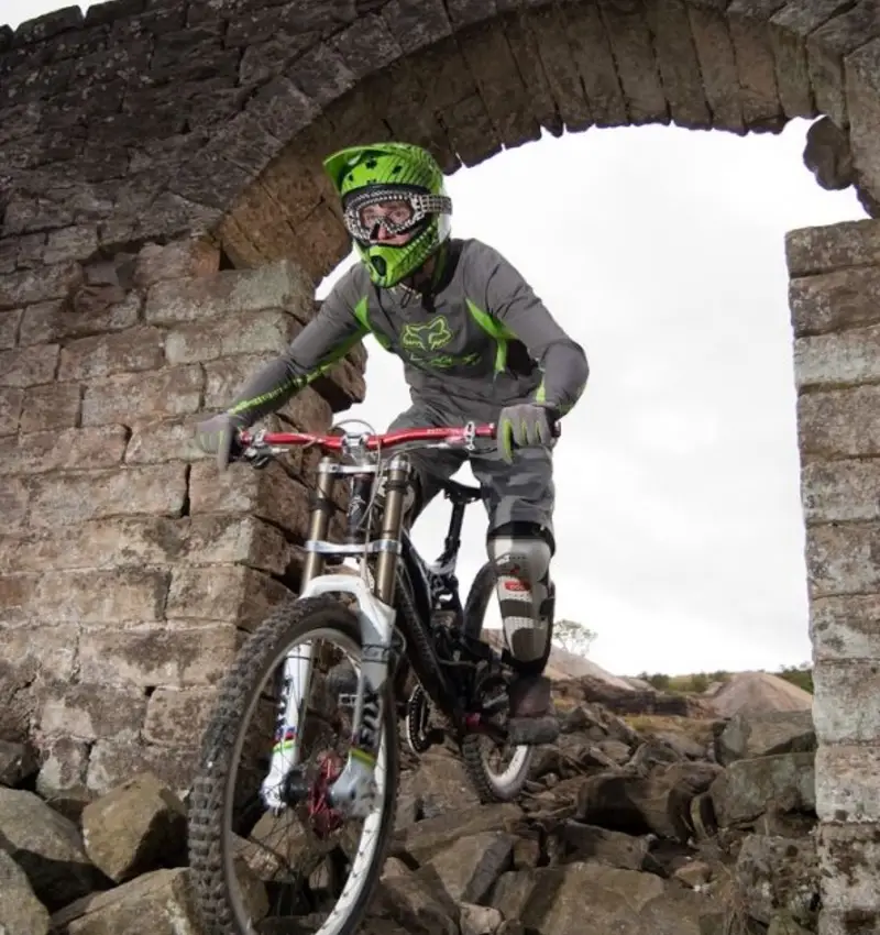 Stif Cycles rider James Wilson through the rocks 