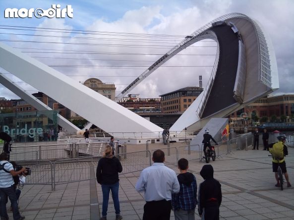 Trials rider preparing to cross bridge.