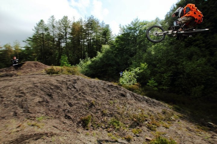 Me doing a jump on a bike with a fred flinstone outfit on. In the sun. Having Fun.
