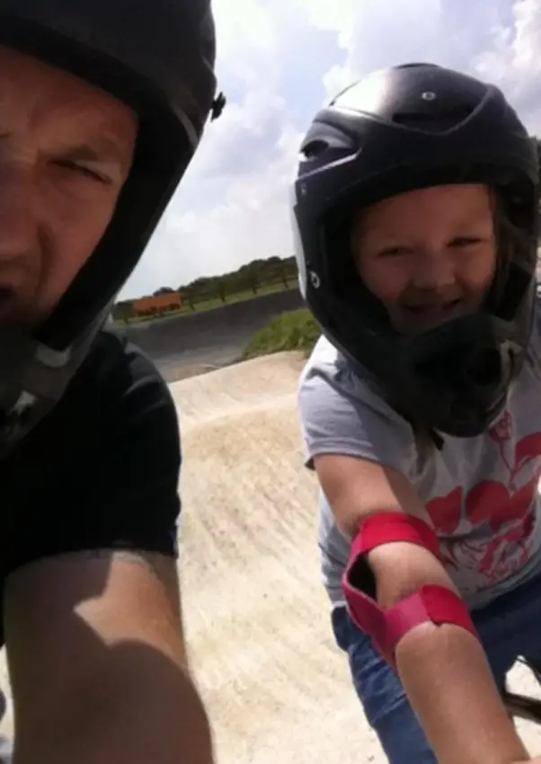 Father and Daughter bonding, on the BMX track.